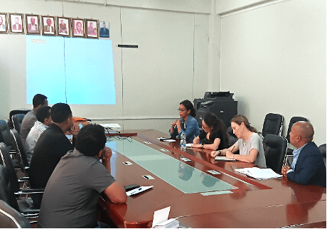 High-level meeting with delegation and regional partners around the conference table.